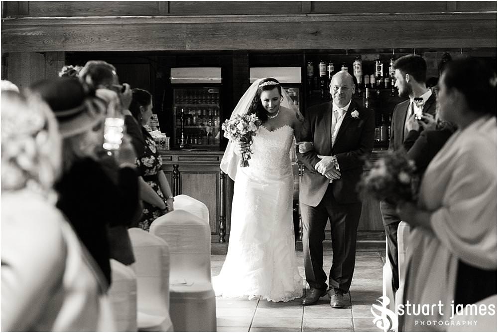Photos that show the emotion during the entrance of the bridal party to the Tythe Barn at The Hundred House in Norton, Telford - Hundred House Wedding Photography by Documentary Wedding Photographer Stuart James