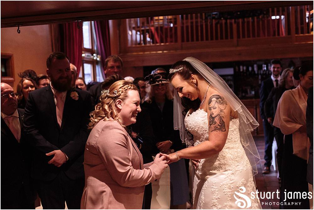 Unobtrusive photos that show the beautiful ceremony in the Tythe Barn at The Hundred House in Norton, Telford - Hundred House Wedding Photography by Documentary Wedding Photographer Stuart James