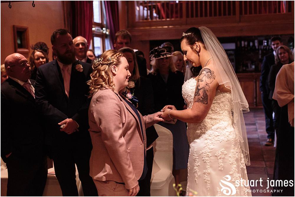 Unobtrusive photos that show the beautiful ceremony in the Tythe Barn at The Hundred House in Norton, Telford - Hundred House Wedding Photography by Documentary Wedding Photographer Stuart James