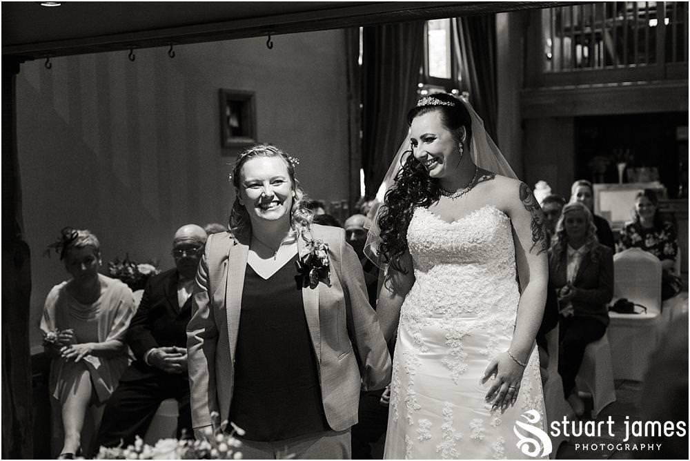 Unobtrusive photos that show the beautiful ceremony in the Tythe Barn at The Hundred House in Norton, Telford - Hundred House Wedding Photography by Documentary Wedding Photographer Stuart James