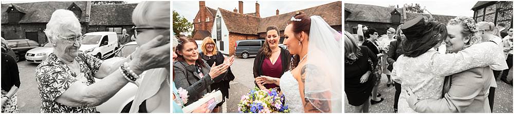 Beautiful moments to capture as the couple are greeted by their guests at The Hundred House in Norton, Telford - Hundred House Wedding Photography by Documentary Wedding Photographer Stuart James