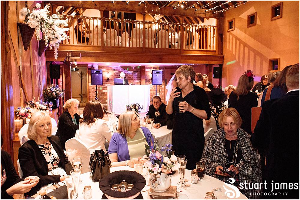 Candid photos capturing the wonderful mood of the evening as the evening guests arrive ready to party the night away at The Hundred House in Norton, Telford - Hundred House Wedding Photography by Documentary Wedding Photographer Stuart James