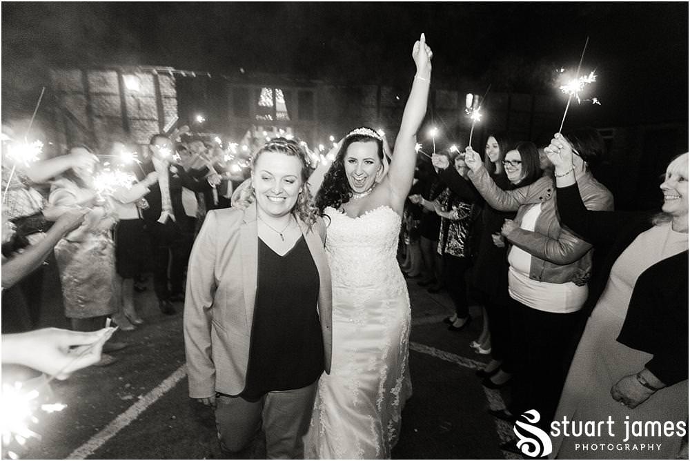 Sparklers exit for our brides to leave the Tythe Barn at The Hundred House in Norton, Telford - Hundred House Wedding Photography by Documentary Wedding Photographer Stuart James