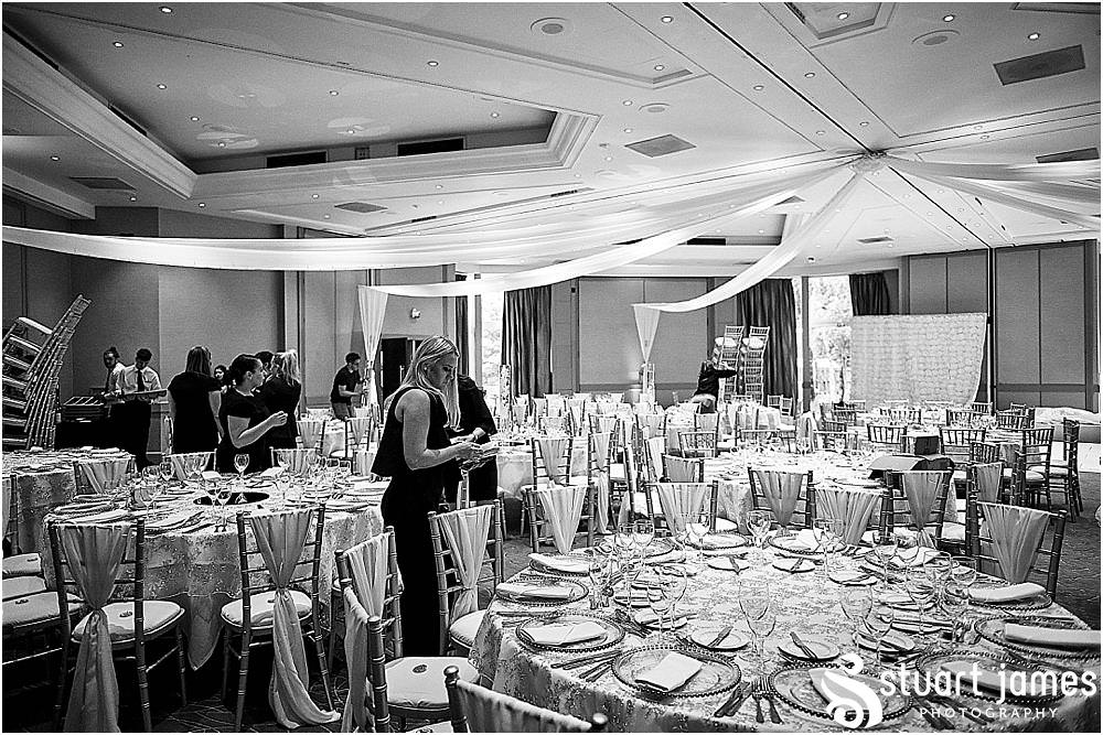 Brining the details together for the wedding reception in The Woodlands Suite at The Belfry in Birmingham by Greek Wedding Photographer Birmingham Stuart James