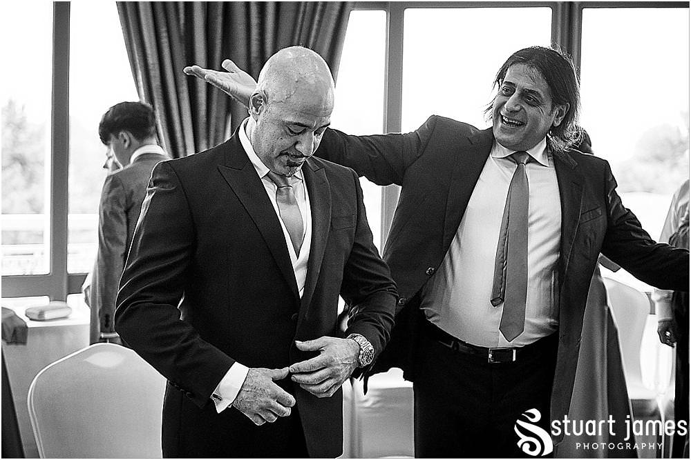 Candid photographs capturing the moments during the stolisma and the emotions of the guests at The Belfry in Birmingham by Greek Wedding Photographer Birmingham Stuart James
