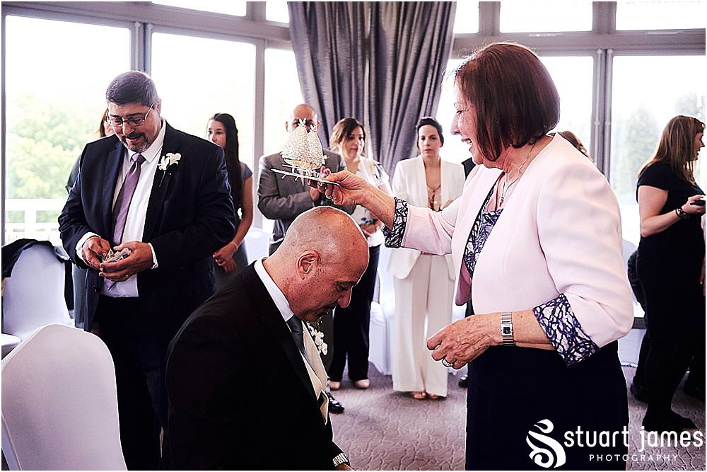 Creative candid photos of the Greek Stolisma ahead of the wedding at The Belfry in Birmingham by Greek Wedding Photographer Birmingham Stuart James