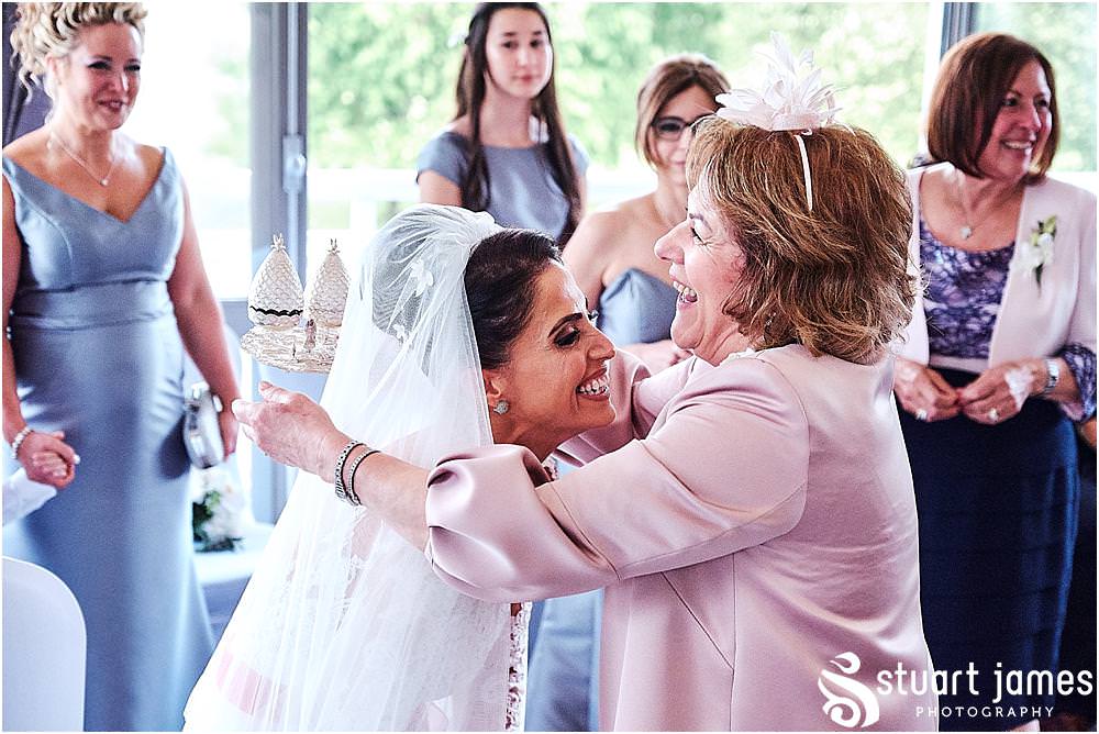 Beautiful moments for the brides family during the Stolisma ahead of the church ceremony and wedding at The Belfry in Birmingham by Greek Wedding Photographer Birmingham Stuart James