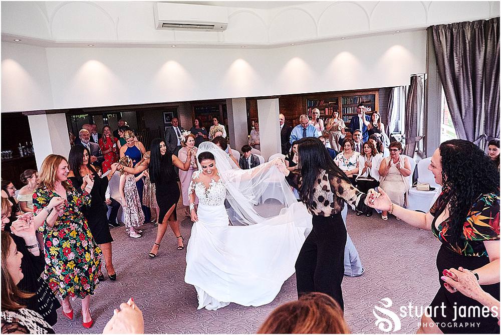 Capturing moments that show the building of emotion during the greek Stolisma at The Belfry in Birmingham by Greek Wedding Photographer Birmingham Stuart James