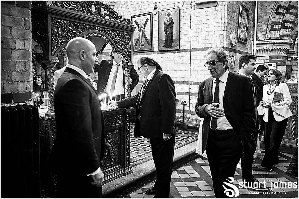 Capturing the arrival of the guests and the bridal party for the wedding at Greek Orthodox Church in Birmingham by Greek Wedding Photographer Birmingham Stuart James