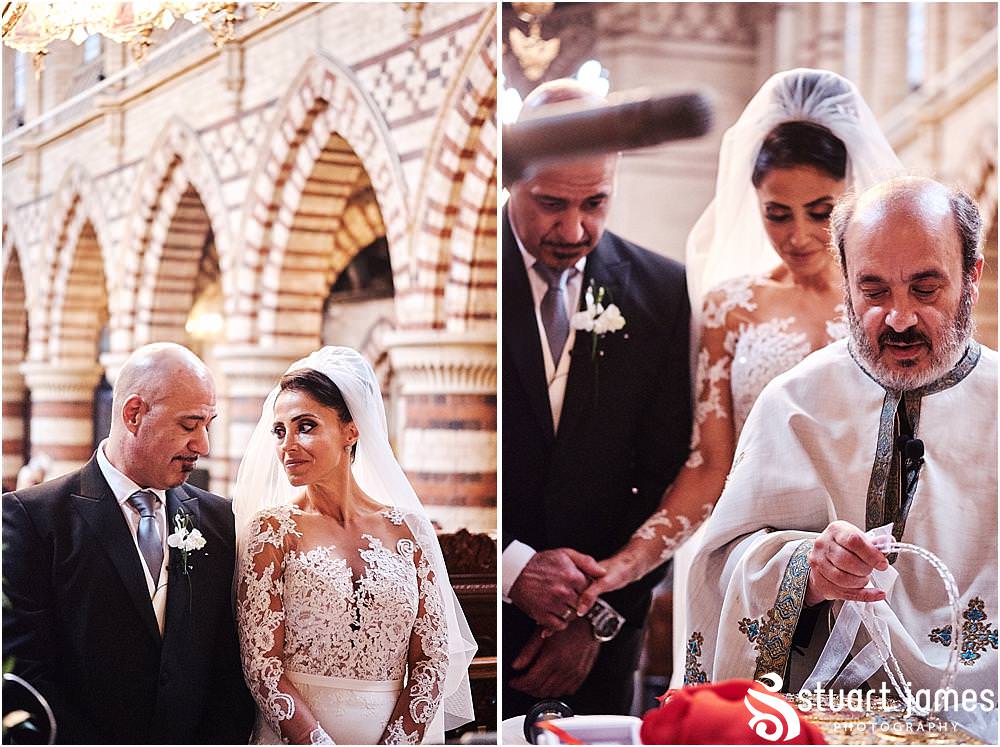 Creative photographs that unobtrusively capture the crown exchange during the wedding ceremony at Greek Orthodox Church in Birmingham by Greek Wedding Photographer Birmingham Stuart James