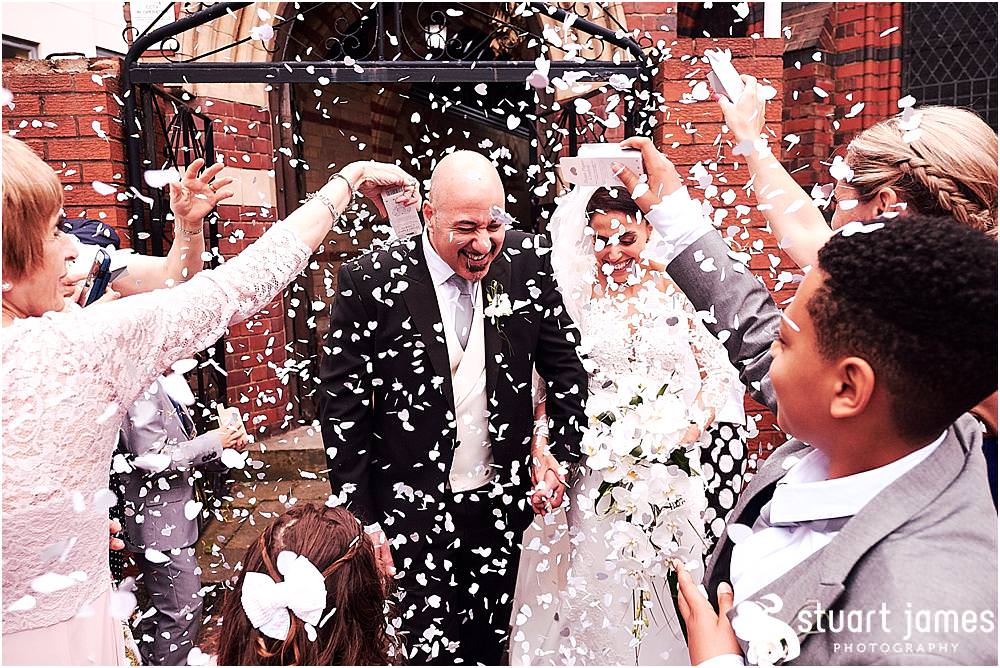 Confetti fun for our bride and grooms exit from church at Greek Orthodox Church in Birmingham by Greek Wedding Photographer Birmingham Stuart James