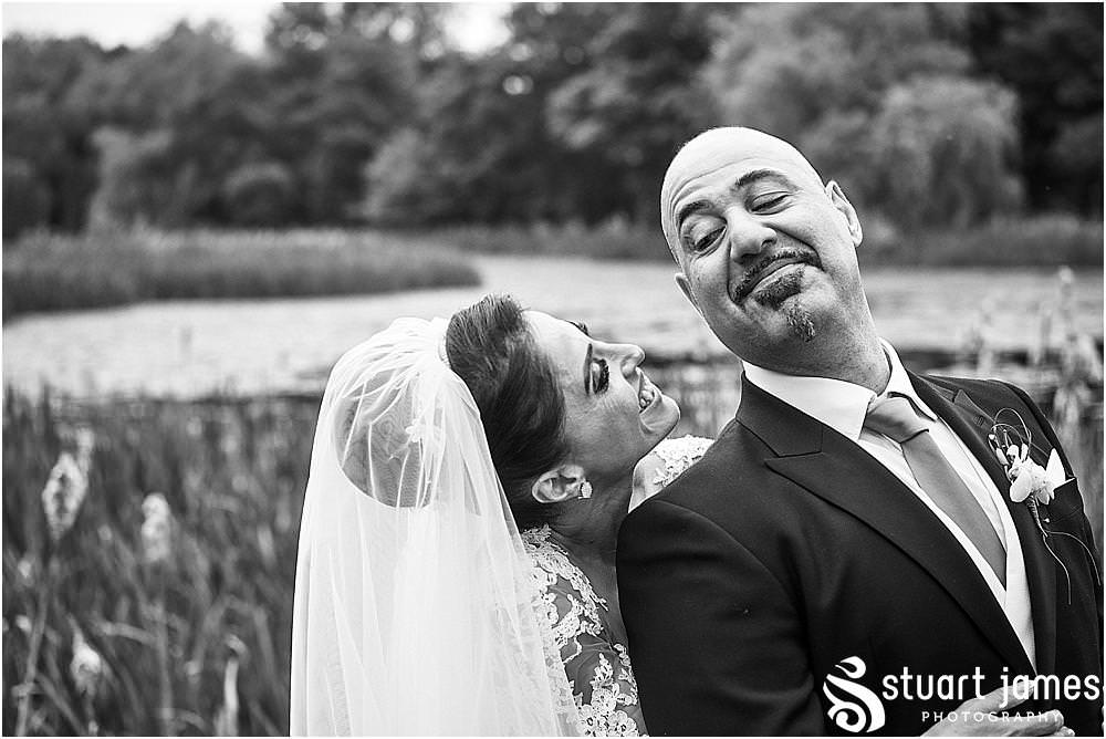 Bride and groom photographs with a view on the Brabazon Course at The Belfry in Birmingham by Greek Wedding Photographer Birmingham Stuart James