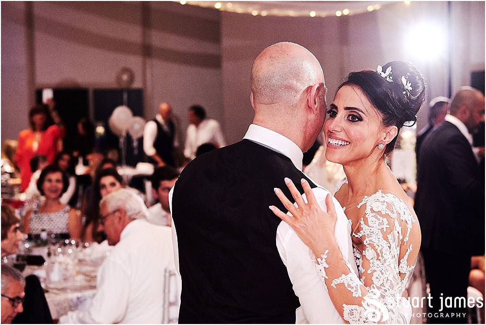 Capturing the fun of the first dance for the bride and groom at The Belfry in Birmingham by Greek Wedding Photographer Birmingham Stuart James