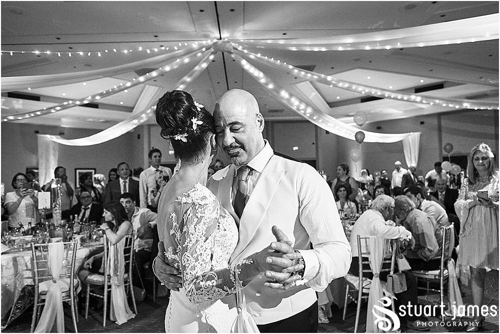 Capturing the fun of the first dance for the bride and groom at The Belfry in Birmingham by Greek Wedding Photographer Birmingham Stuart James