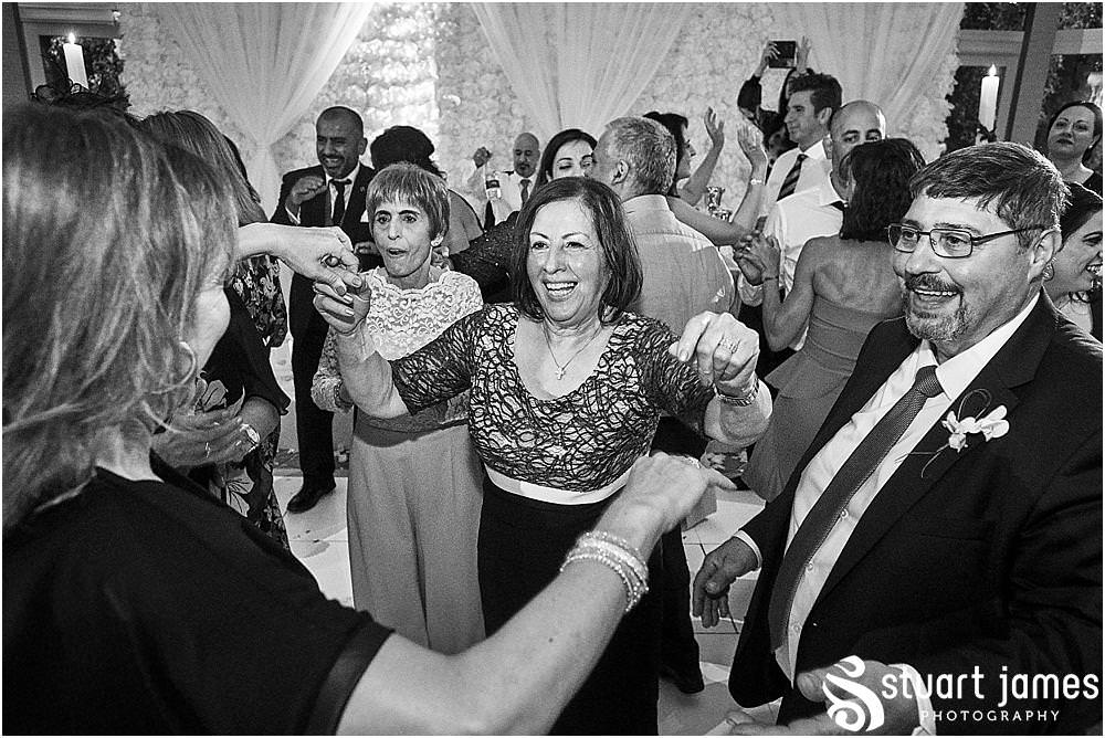 As the dancing gets underway, see the photos capturing the fabulous spirit at The Belfry in Birmingham by Greek Wedding Photographer Birmingham Stuart James