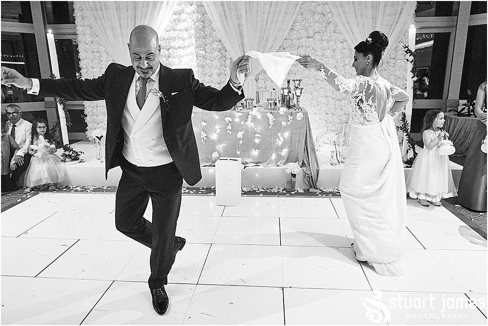 Creatively capturing the Greek Wedding Dance at The Belfry in Birmingham by Greek Wedding Photographer Birmingham Stuart James