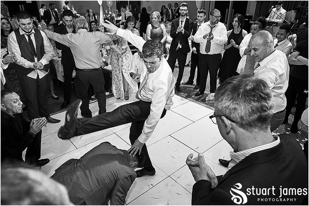 With greek dancing and amazing music, this was one fabulous party at The Belfry in Birmingham by Greek Wedding Photographer Birmingham Stuart James