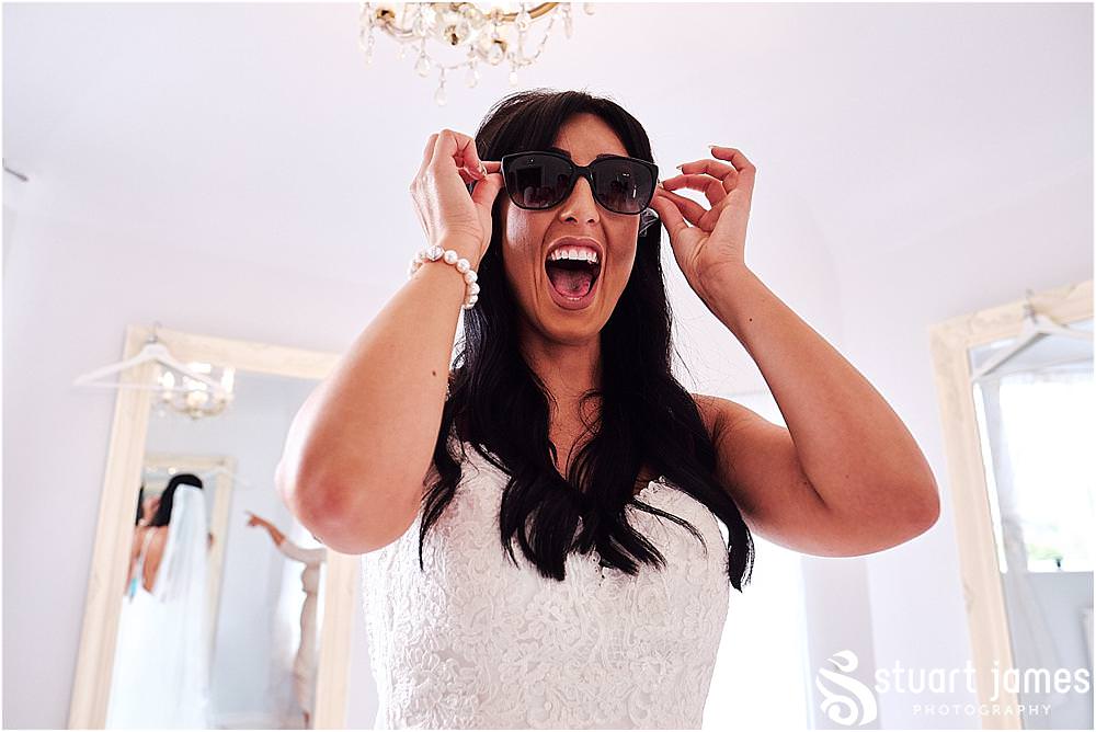 Capturing the fabulous reactions to the gifts from the groom on the wedding morning at Hawkesyard Estate in Rugeley by Documentary Wedding Photographer Stuart James