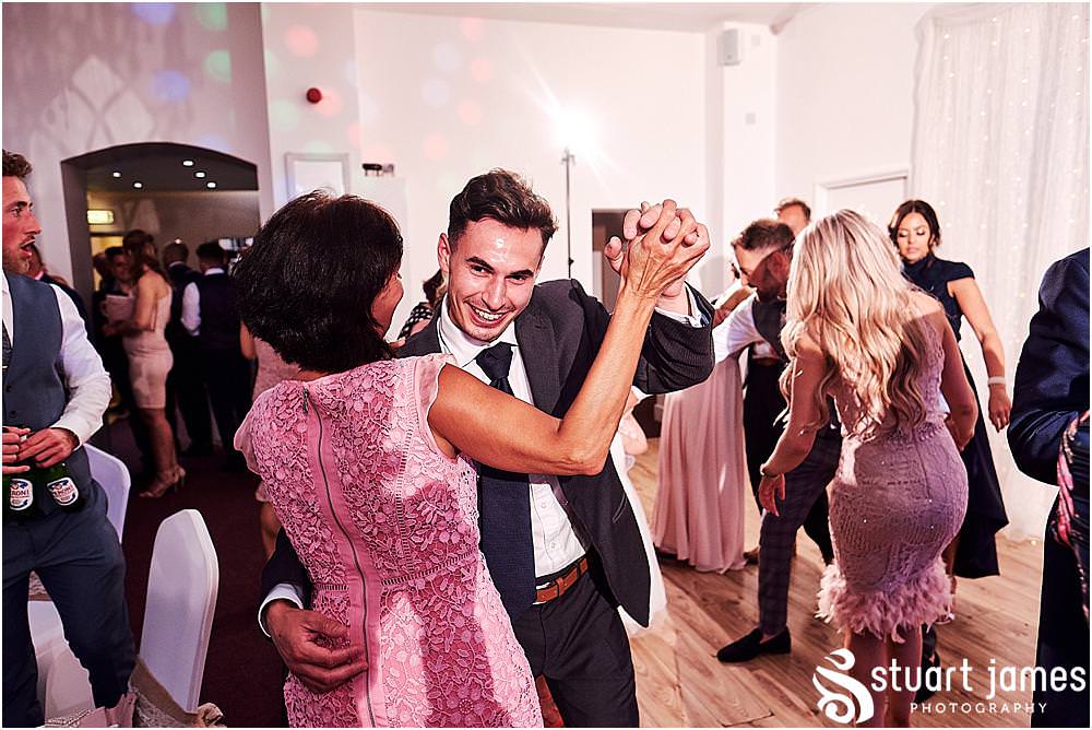 Capturing the spirit of the evening as the guests truly let loose and enjoy the reception at Hawkesyard Estate in Rugeley by Documentary Wedding Photographer Stuart James