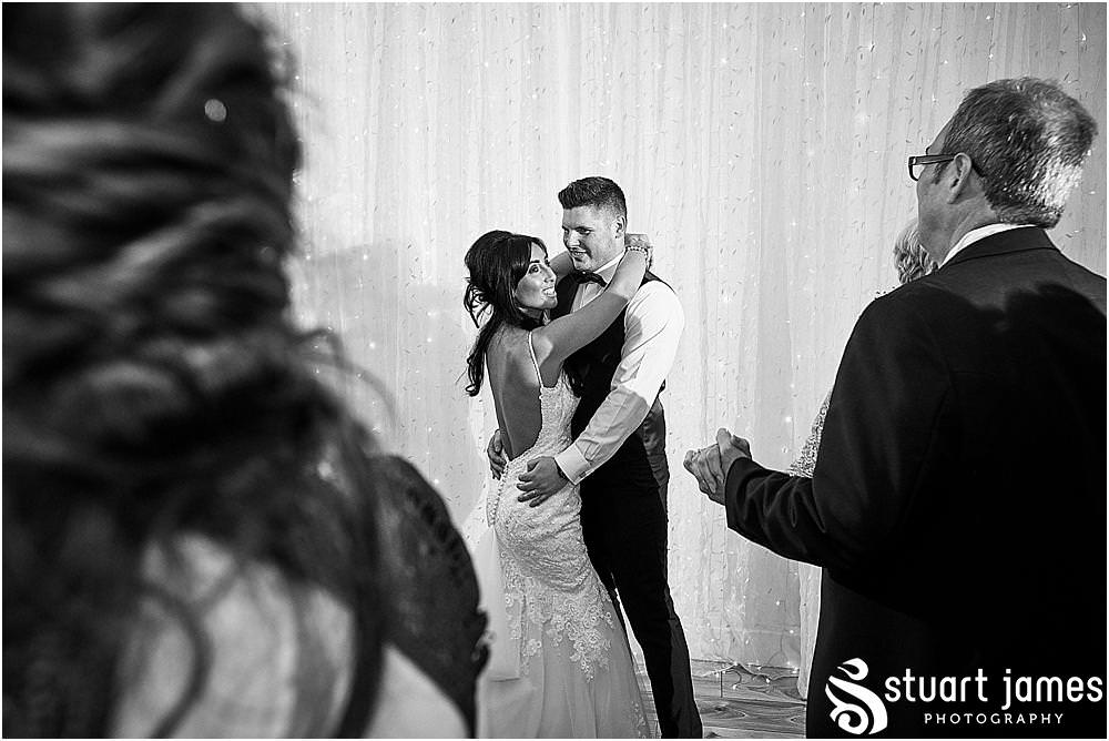 Creative photographs of the evening reception as the bride and groom brings the final formalities of the day with the cake cutting and first dance at Hawkesyard Estate in Rugeley by Documentary Wedding Photographer Stuart James