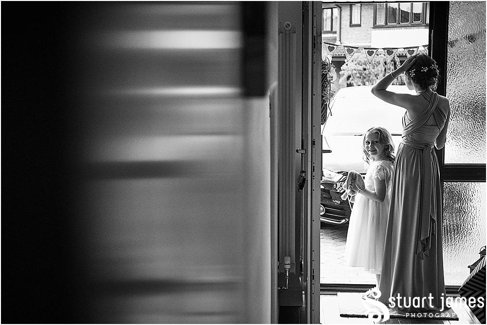 A stolen moment as our Flowergirl spots the camera - wedding at St Michaels Church by Penkridge Wedding Photographer Staffordshire Stuart James