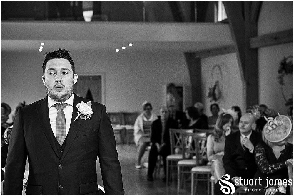 Capturing the procession of the Bridal Party into the ceremony room for the wedding at The Mill Barns photos by Mill Barns Wedding Photographer Stuart James