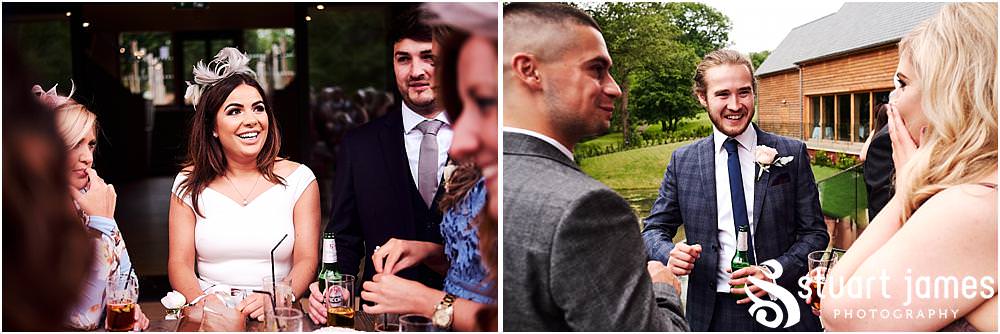 Creative candid photographs capturing the guests enjoying wonderful reception at The Mill Barns photos by Mill Barns Wedding Photographer Stuart James