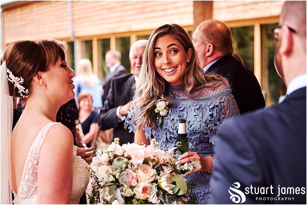 Creative candid photographs capturing the guests enjoying wonderful reception at The Mill Barns photos by Mill Barns Wedding Photographer Stuart James