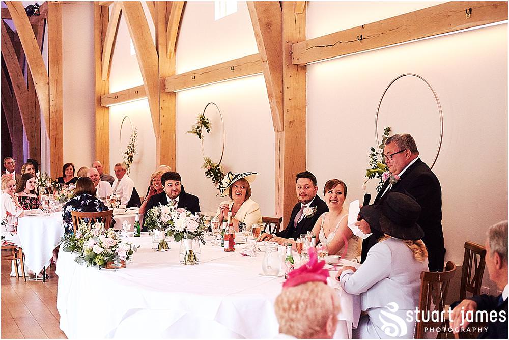 Documenting the speeches and the storytelling reactions of the guests at The Mill Barns photos by Mill Barns Wedding Photographer Stuart James