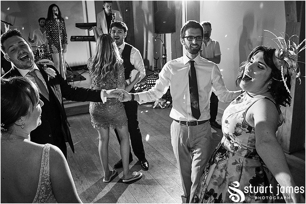 Capturing the wedding from the inside out, right in the mix of the action on the dancefloor with Mill Barns Wedding Photographer Stuart James