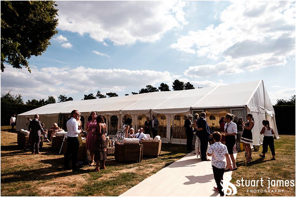 Creative candid photographs as the guests enjoy the wedding reception - Newton Solney Wedding Photographer Stuart James