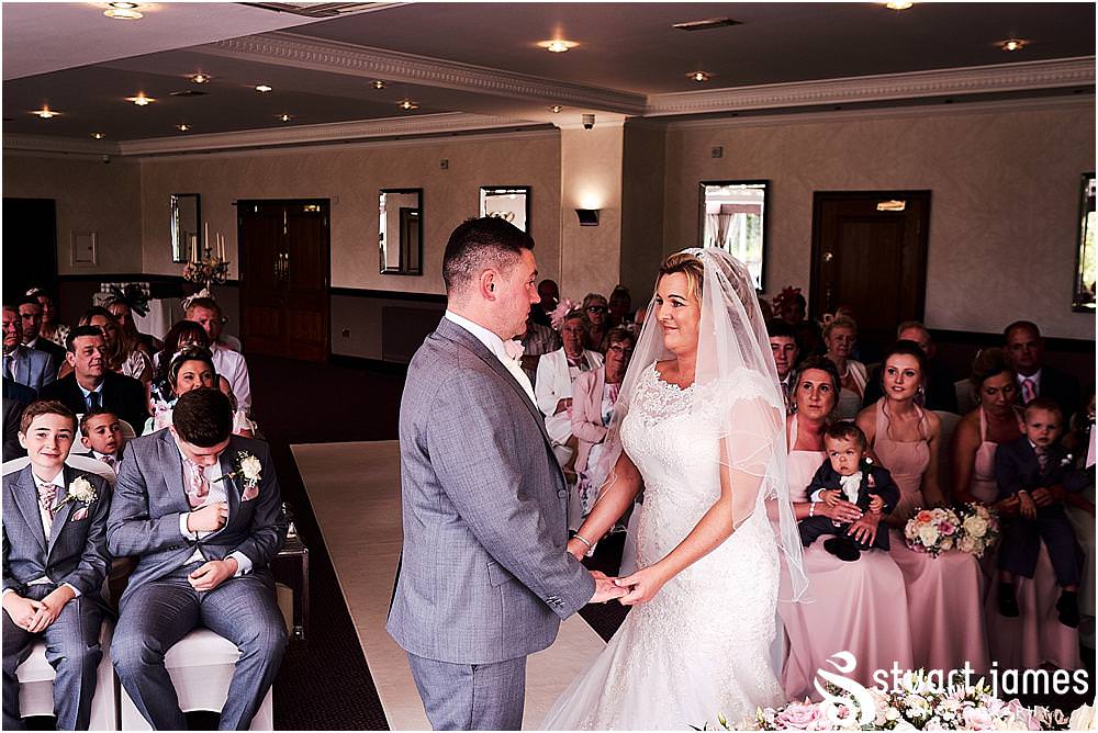 Unobtrusive natural photographs capturing the beautiful wedding ceremony at The Moat House in Acton Trussell by Penkridge Wedding Photographer Stuart James