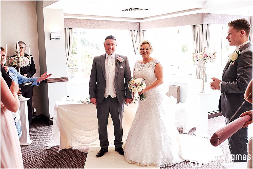 Photos that unobtrusively capture the story as the bride and groom wed in the Acton Suite at The Moat House in Acton Trussell by Penkridge Wedding Photographer Stuart James