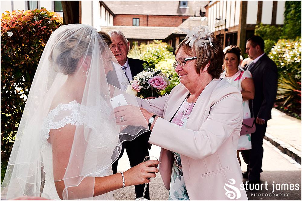 Creative candid photographs capturing the guests enjoying the drinks reception at The Moat House in Acton Trussell by Penkridge Wedding Photographer Stuart James