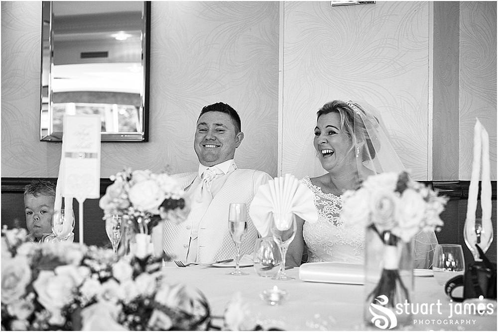 Capturing the wonderful reactions to the entertaining and heartfelt speeches at The Moat House in Acton Trussell by Penkridge Wedding Photographer Stuart James