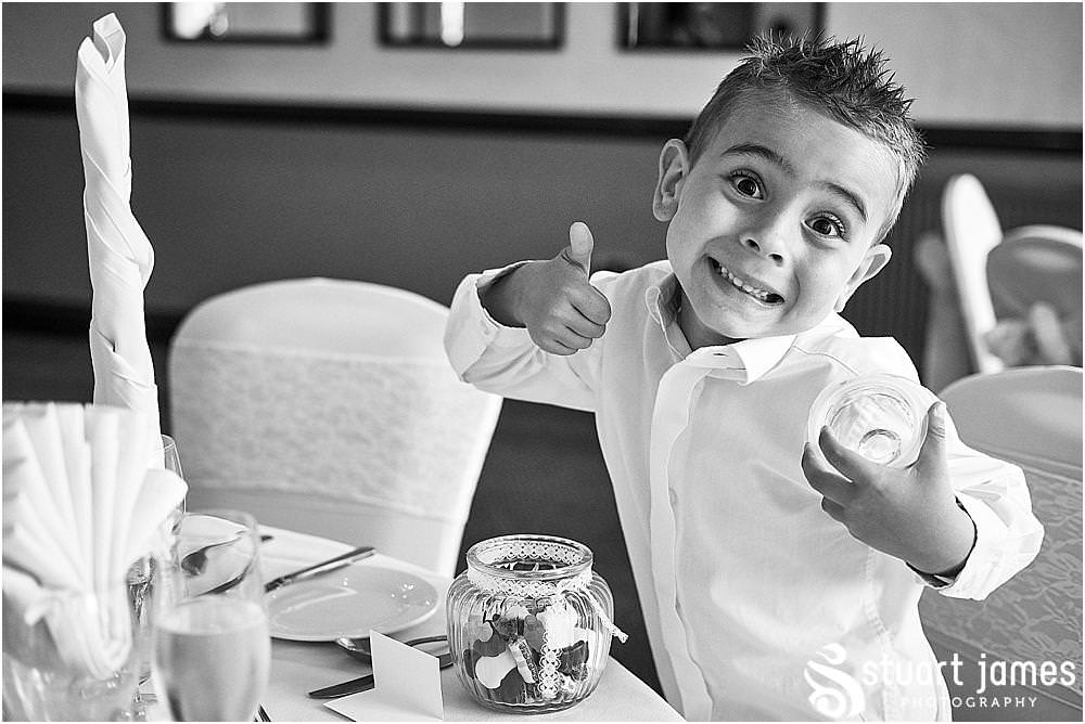 Natural candid photographs capturing the guests enjoying the wedding breakfast at The Moat House in Acton Trussell by Penkridge Wedding Photographer Stuart James