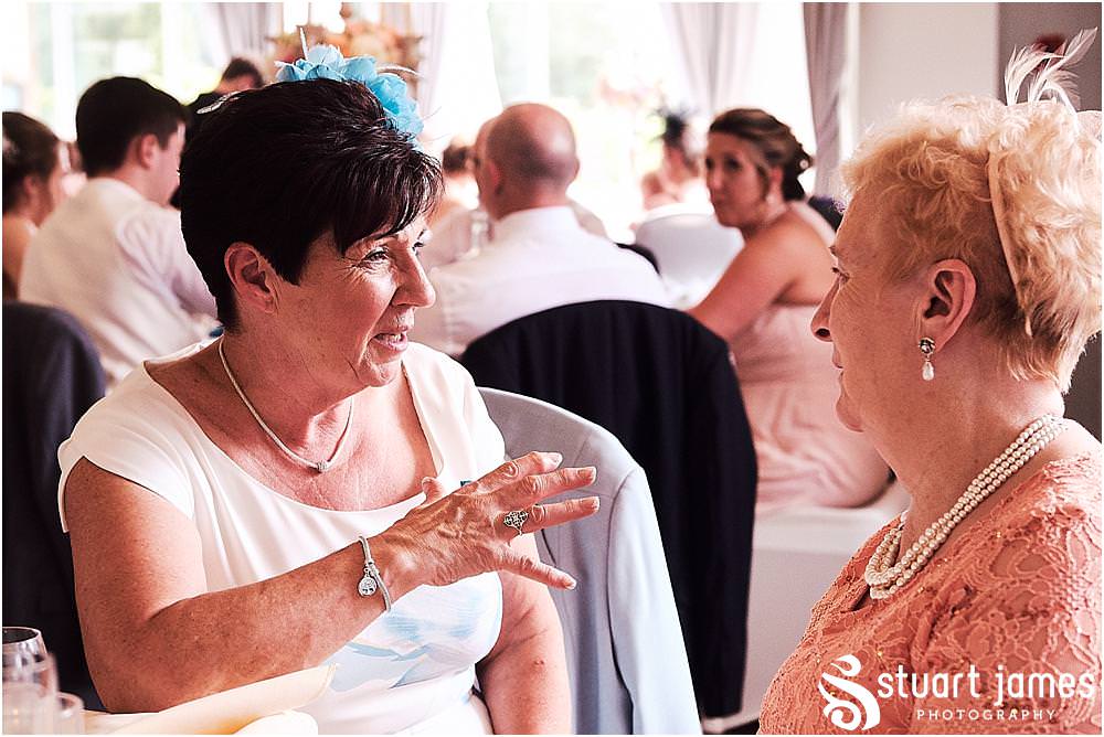 Natural candid photographs capturing the guests enjoying the wedding breakfast at The Moat House in Acton Trussell by Penkridge Wedding Photographer Stuart James