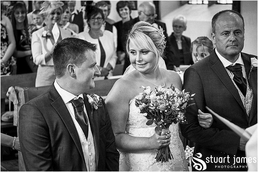 Creative images capturing the emotion and story as the bridal party process into the church to our waiting groom. Photos by Uttoxeter Wedding Photographer Stuart James