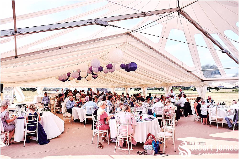 Reportage photos of the guests enjoying the amazing reception in the marquee in Bramshall. Photos by Uttoxeter Wedding Photographer Stuart James