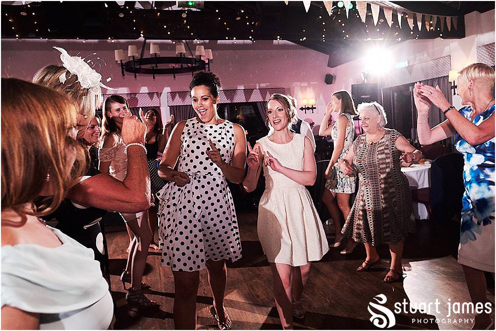 Right in the middle of the party, capturing every moment as the guests enjoy the most amazing wedding at Oak Farm Hotel in Cannock by Cannock Wedding Photographers Stuart James