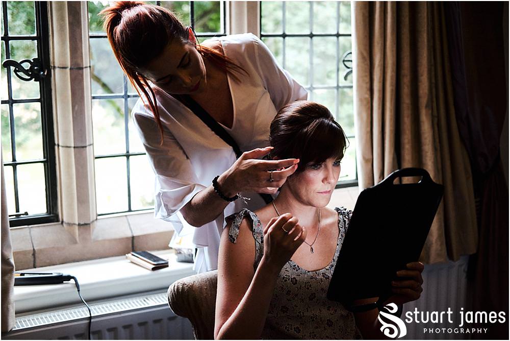 Bridal preparations with hair and makeup for our bridal party at Moxhull Hall in Sutton Coldfield by Moxhull Hall Wedding Photographer Stuart James