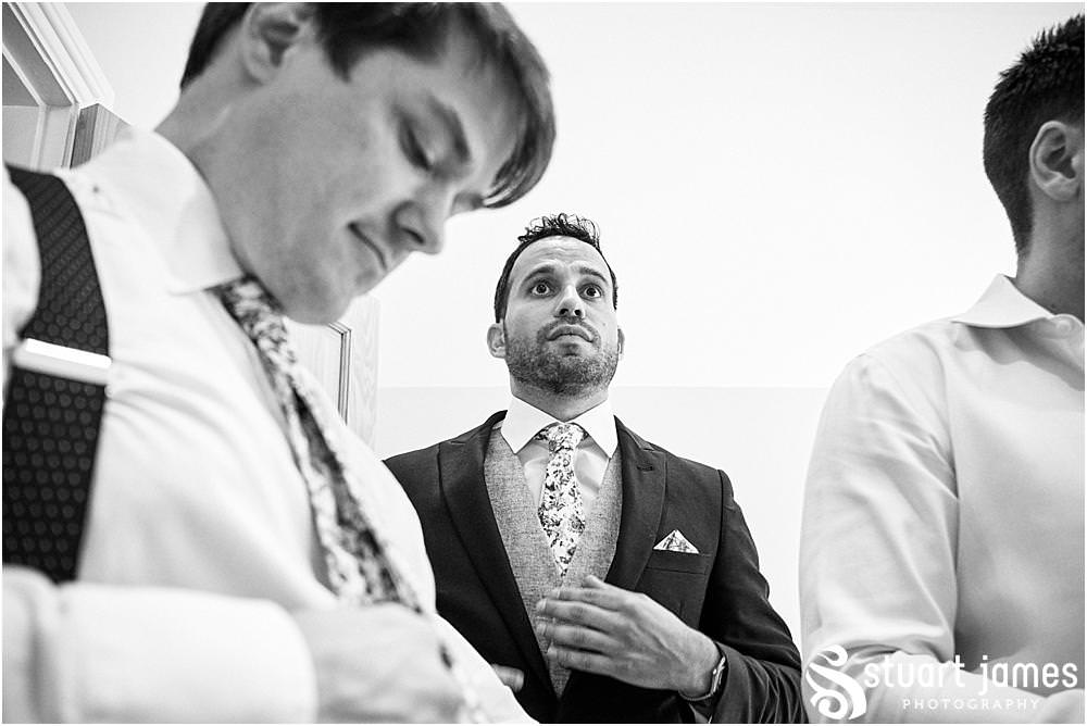 Candid photos as the groomsmen get ready for the wedding at Moxhull Hall in Sutton Coldfield by Moxhull Hall Wedding Photographer Stuart James