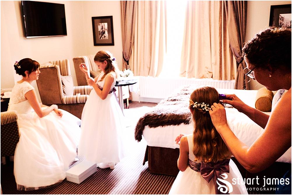 Capturing the excitement as our bride dresses ready for the wedding at Moxhull Hall in Sutton Coldfield by Moxhull Hall Wedding Photographer Stuart James