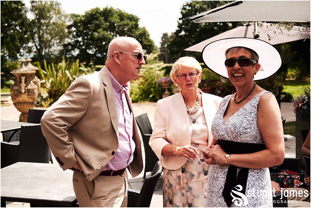 Candid photographs as the guests arrive ready for the beautiful wedding ceremony at Moxhull Hall in Sutton Coldfield by Moxhull Hall Wedding Photographer Stuart James
