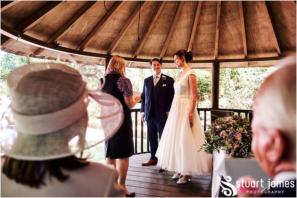 Unobtrusive photos that show the beautiful wedding ceremony in Galliopes Garden at Moxhull Hall in Sutton Coldfield by Moxhull Hall Wedding Photographer Stuart James