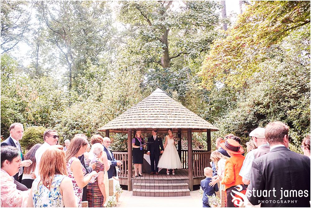 Unobtrusive photos that show the beautiful wedding ceremony in Galliopes Garden at Moxhull Hall in Sutton Coldfield by Moxhull Hall Wedding Photographer Stuart James