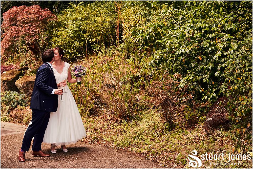 Fun candid photographs as the guests greet the new Mr & Mrs and enjoy the drinks reception on the lawns at Moxhull Hall in Sutton Coldfield by Moxhull Hall Wedding Photographer Stuart James