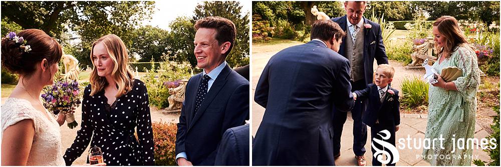 Fun candid photographs as the guests greet the new Mr & Mrs and enjoy the drinks reception on the lawns at Moxhull Hall in Sutton Coldfield by Moxhull Hall Wedding Photographer Stuart James