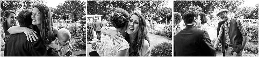 Fun candid photographs as the guests greet the new Mr & Mrs and enjoy the drinks reception on the lawns at Moxhull Hall in Sutton Coldfield by Moxhull Hall Wedding Photographer Stuart James