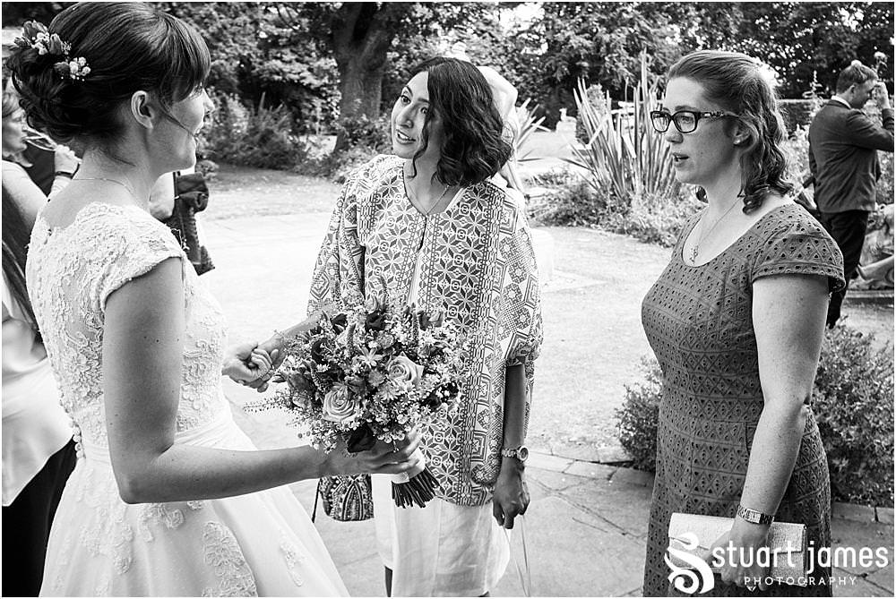 Fun candid photographs as the guests greet the new Mr & Mrs and enjoy the drinks reception on the lawns at Moxhull Hall in Sutton Coldfield by Moxhull Hall Wedding Photographer Stuart James